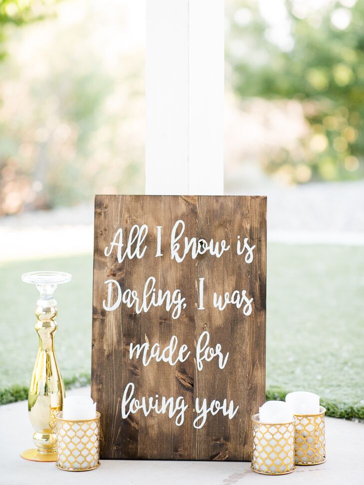Calligraphed wooden signs were placed throughout the event, adding to the day's rustic, romantic feel.