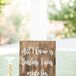 Calligraphed wooden signs were placed throughout the event, adding to the day's rustic, romantic feel.