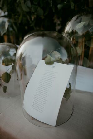 Eucalyptus and Seating Charts Under Glass Cloche