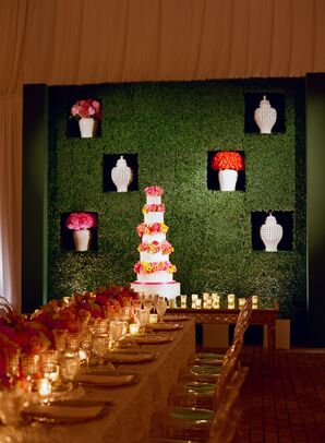 Boxwood Wall Installation with Bright Flower Arrangements and White Vintage Vases