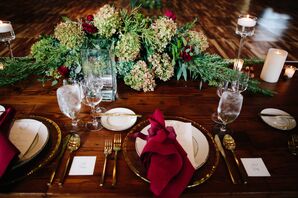Table Setting with Red Linens and Gold Flatware
