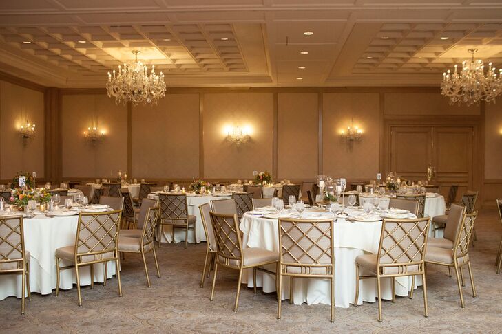 Warm golds and soft champagne hues paired with the antique-inspired decor of the hotel for an elegant reception look.