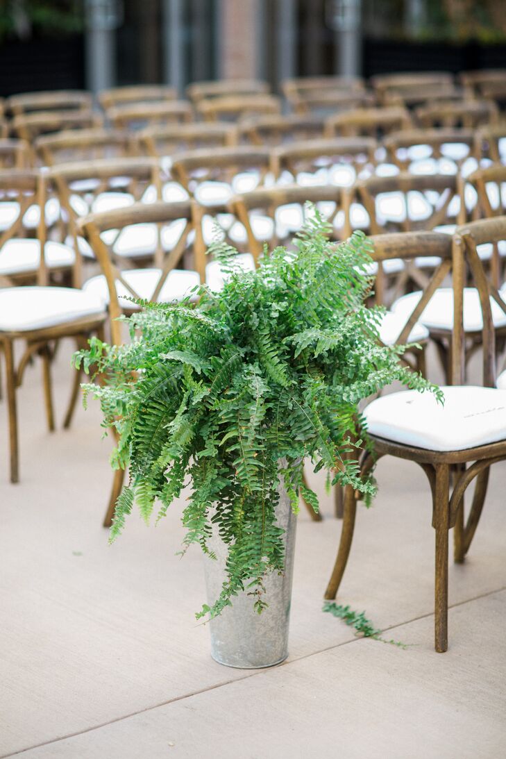 Cascading Fern Aisle Arrangements in Metallic Vases