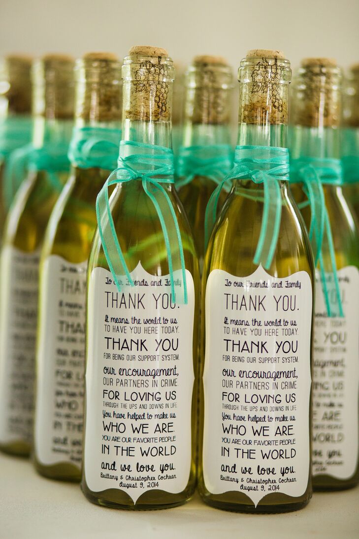 The bride's mom made homemade wine for guests to take home that were covered with "thank you" labels the bride designed herself.