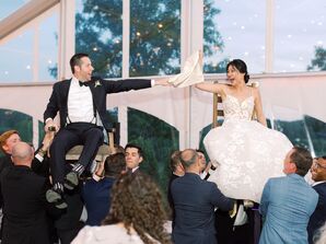 Bride and Groom in Chairs During Horah at Jewish Wedding Reception