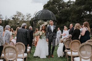 Bride and Groom After Ceremony Under Iron Gazebo