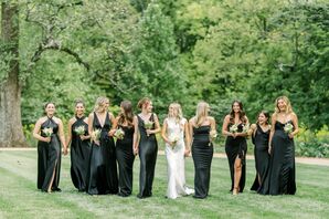 Bride in Sleek, High-Neck Dress and Bridesmaids in Different Black Gowns With Small White Bouquets