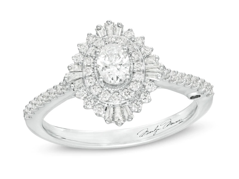 Oval diamond center with starburst halo and pave diamonds on band