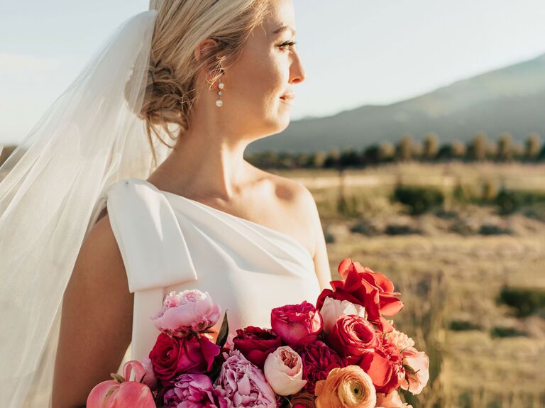 bride wearing one shoulder wedding dress