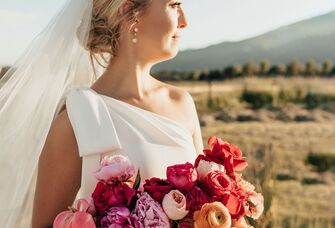bride wearing one shoulder wedding dress