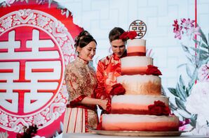 Bride and Groom in Traditional Hakka Chinese Attire Cutting a Five-Tier, Colorful Cake