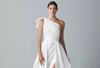 Satin draped one shoulder column gown with front slit