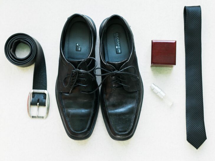 Mark wore a black suit with black accessories, while the groomsmen sported gray suits.