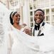 Bride With Ornate Crystal Headpiece, Flowing Veil and Groom in White Tuxedo Laughing