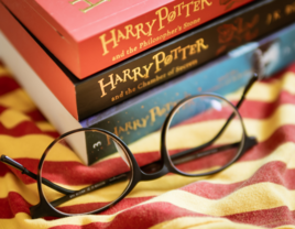 Stack of harry Potter books with glasses