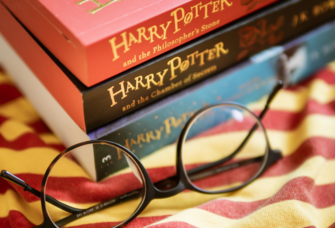 Stack of harry Potter books with glasses