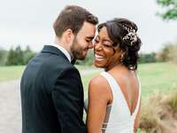 Bride and groom posing for formal wedding portraits