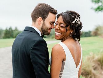 Bride and groom posing for formal wedding portraits