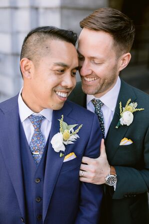 Couple in Suits Smiling and Hugging