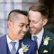Couple in Suits Smiling and Hugging