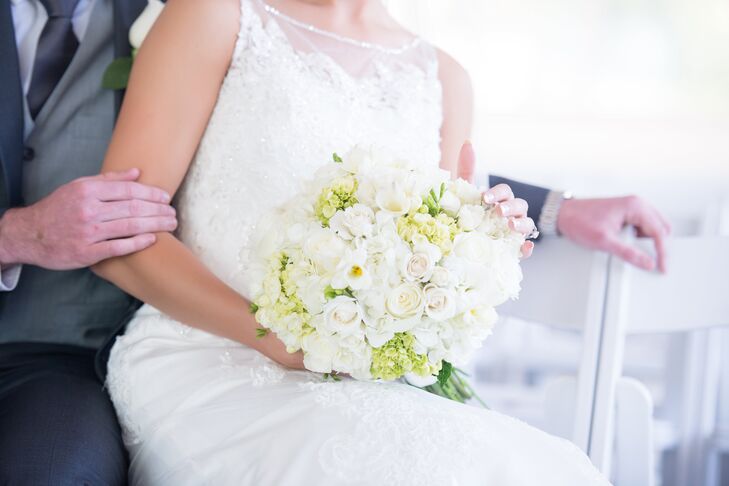 Brianna carried a white, textured bouquet of hydrangeas, roses and freesia with pops of greens.