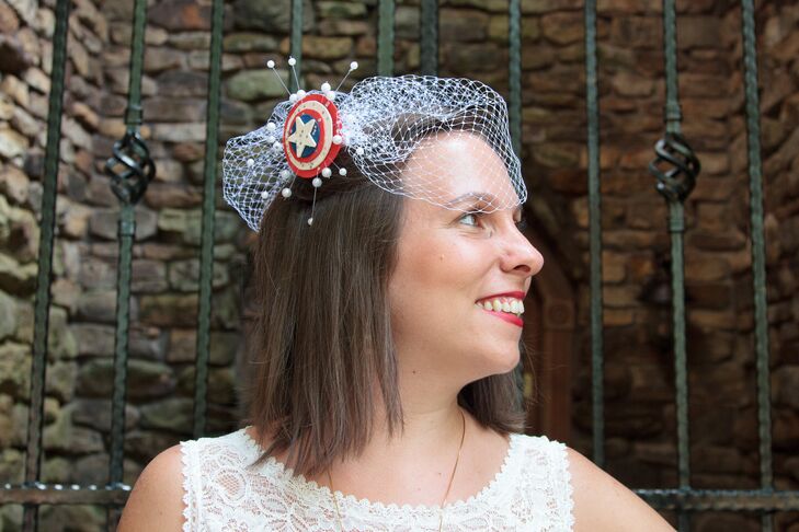 Rebecca wore an birdcage veil with a Captain America Shield decorating the middle.