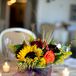 Small Fall-Colored Centerpieces with Sunflowers and Votive Candles