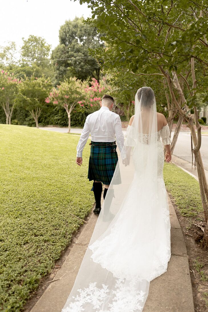 Bride Wearing Veil Holding Hands With Groom Wearing Kilt