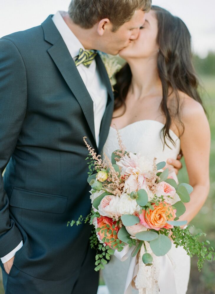 Nicole carried a coral and ivory bunch of garden roses, dahlias, astilbe, scabiosa, eucalyptus, mint, and maidenhair fern (Alex's favorite). The stems were wrapped in a lace ribbon from her grandmother's wedding dress, a sentimental touch.