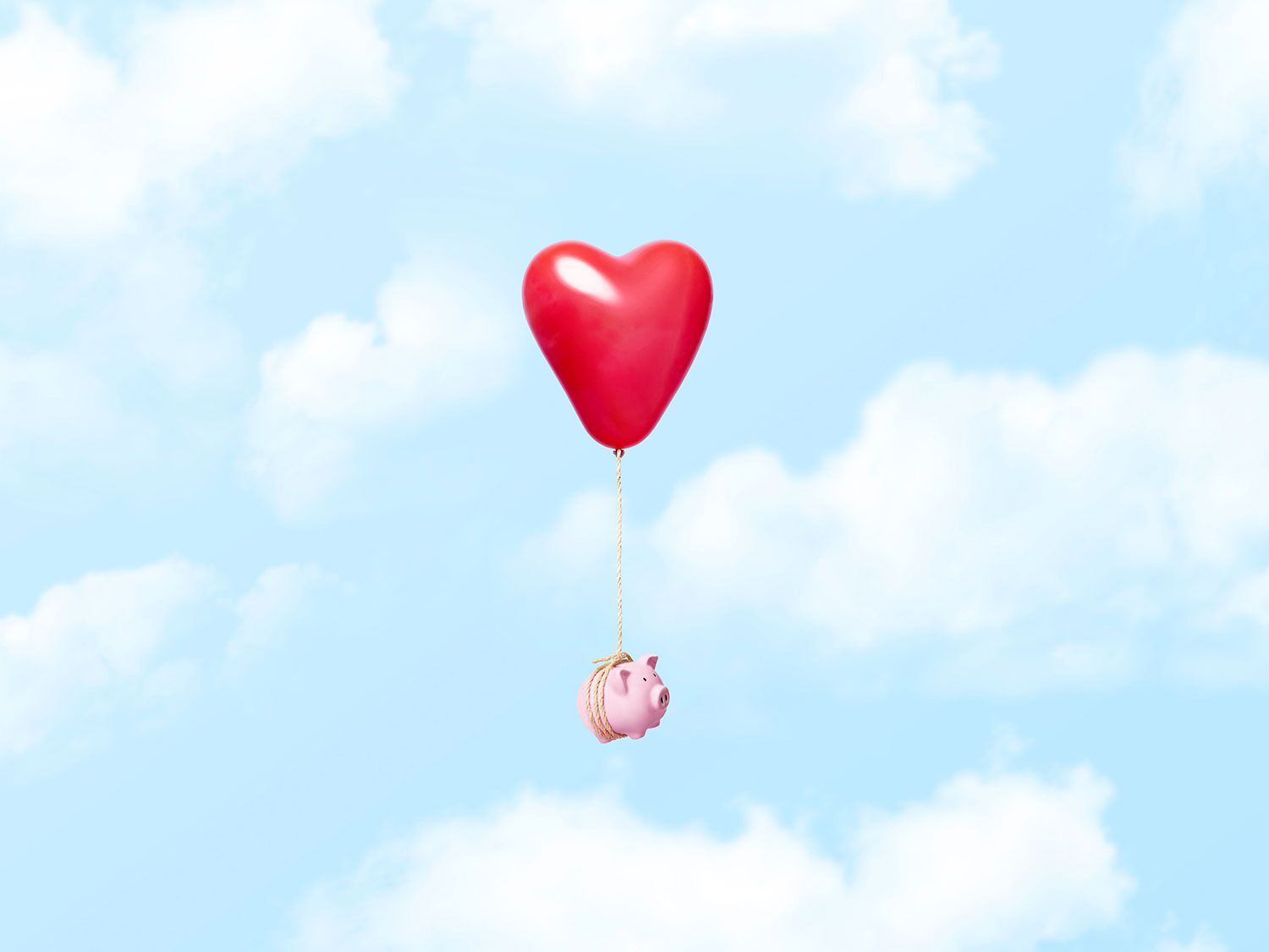 piggy bank with heart floating away for recession conversations couples