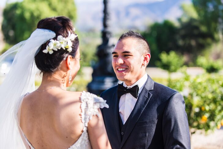 Groom Smiles at his Bride during the First Look