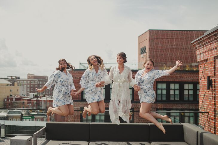 Bride and Bridesmaids in Robes Jumping on Rooftop at The Line Hotel in Washington, DC