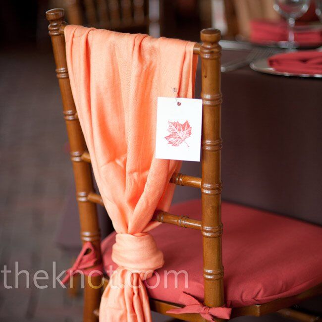 All of the ladies at the wedding found orange pashminas tied to their seats—a fitting favor for the chilly fall evening.