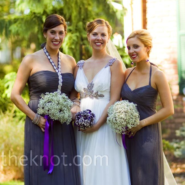 The bridesmaids stood out in two different charcoal-gray dresses by Amsale.