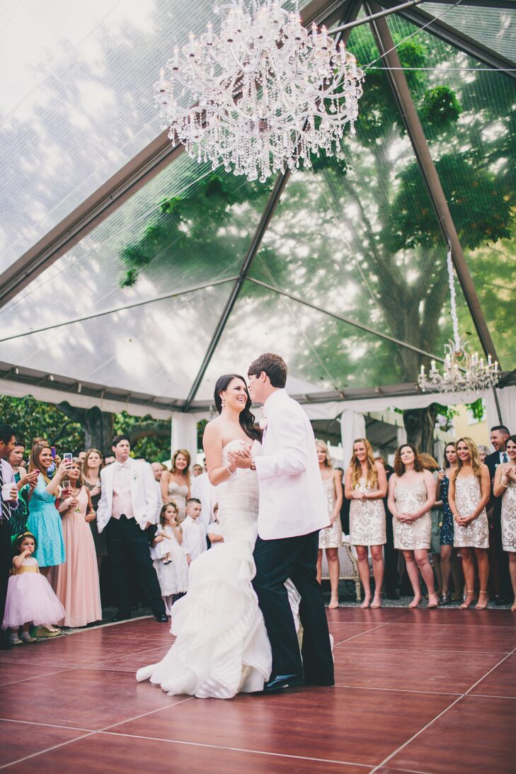 Courtney chose a Hayley Paige dress for her classic nuptials. She wanted her look to be fun while still elegant. The stripes in the dress’s fabric was the perfect amount of unexpected. She completed her look with a simple veil, statement earrings and silver Jimmy Choo heels.