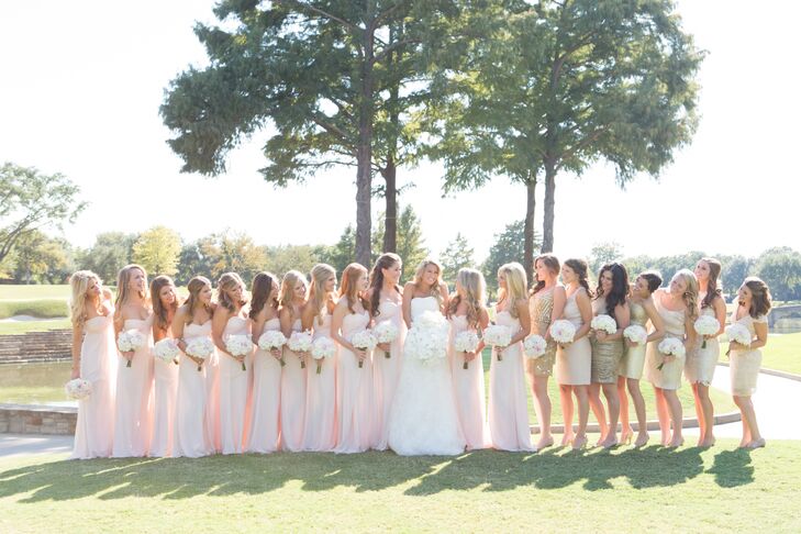 Megan had 12 bridesmaids and seven honorary members of her bridal party. “I love all my friends and really couldn’t imagine the day without any of them,” Megan says. The bridesmaids wore floor-length Monique Lhuillier gowns in a soft pink hue, while the rest of the women donned gold and champagne dresses of their choosing. “My mom, sister, grandmother and I picked the dress together. We wanted something that was feminine and classic that was going to flatter every type of figure,” Megan says.