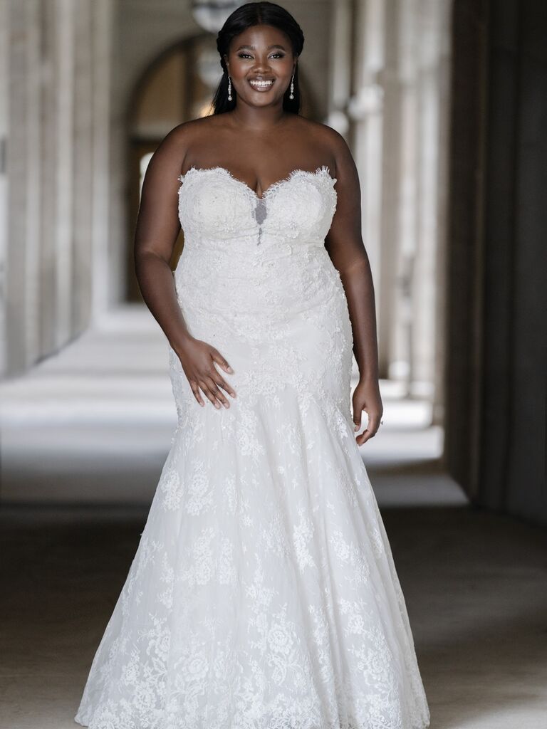 Strapless lacy sheath gown with blossom detail for older bride