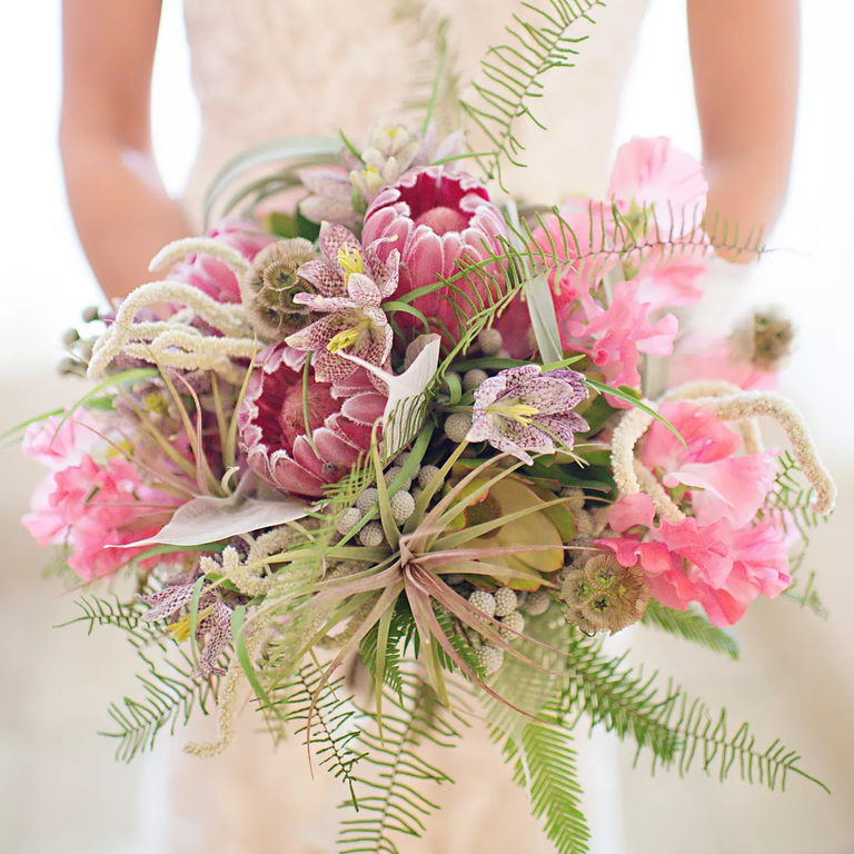 Snapdragon and protea wedding bouquet in shades of pink and lavender