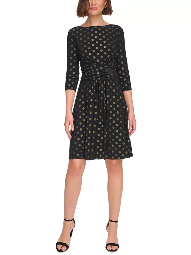 Model wearing a polka dot metallic dress with three-quarter sleeves