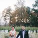 Bride and Groom Posing in Ceremony Aisle at Farm in Chadbourn, North Carolina