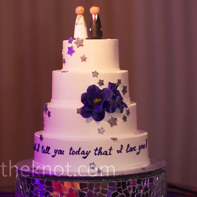Silver stars cascaded down the wedding cake to the bottom tier, where “Did I tell you today that I love you?” was written in script.