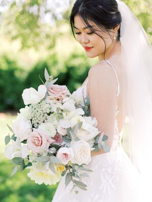 Bride With Updo Holding Bouquet of Roses and Queen Anne's Lace