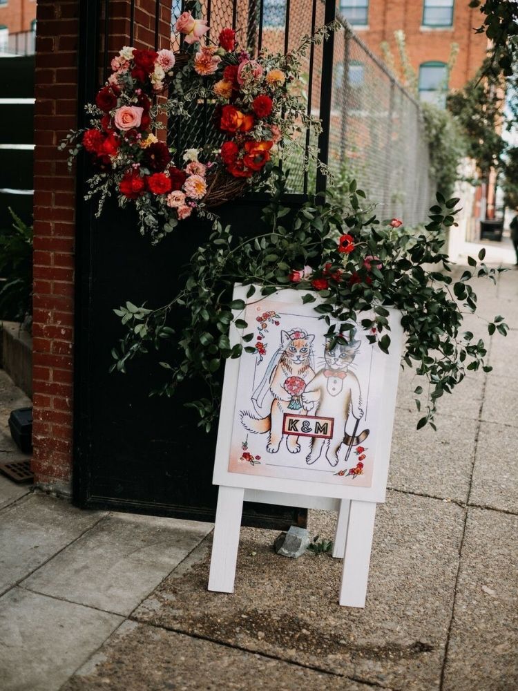 cat-themed wedding welcome sign