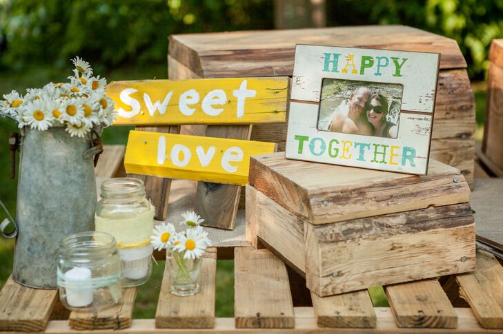 “I was inspired first by the idea of using wooden pallets for all the furniture and tables,” says Jessica. “Michael built the tables our food tables, the bar, the arbor, croquet stand, the guest sign in, a lemonade stand, and even the cake table. I sketched everything I pictured it in my mind and he built it!”