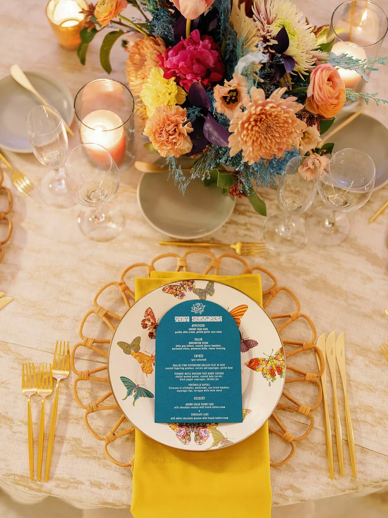 Yellow wedding reception place setting with butterfly plate 