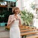 Bride in Fitted Gown, Shoer Hairstyle Smiling at Her Industrial-and-Garden Ceremony Before Wedding