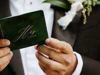 Groom holding vows