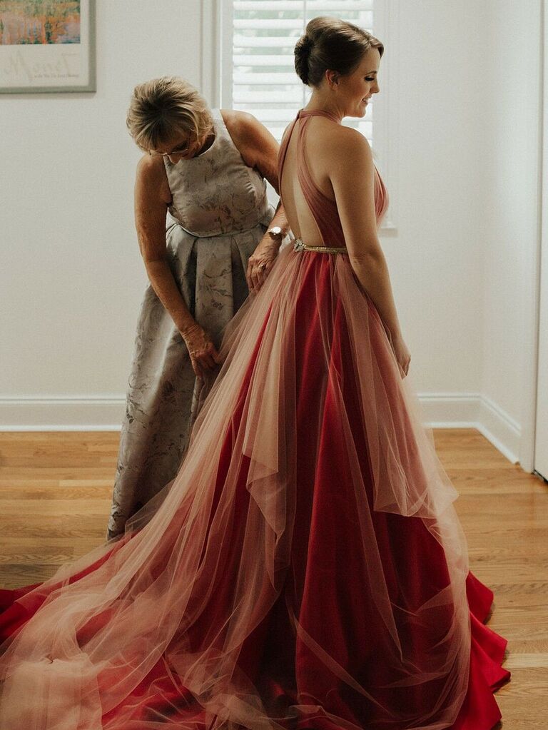 Bride getting ready with mom on wedding day
