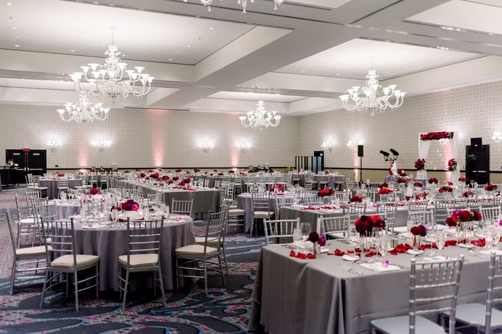 Modern Ballroom Reception with Gray Linens and Red Centerpieces