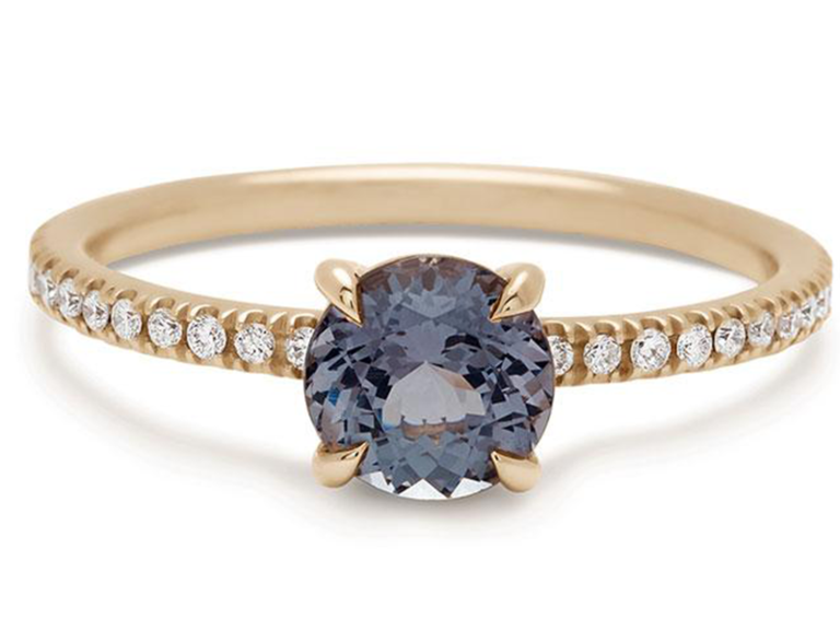 Gray spinel center stone and pave diamonds on thin gold band